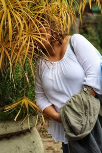 High angle view of woman standing by plants