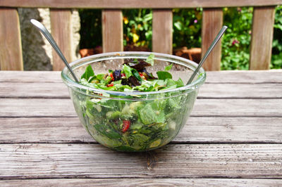 Salad in bowl on table