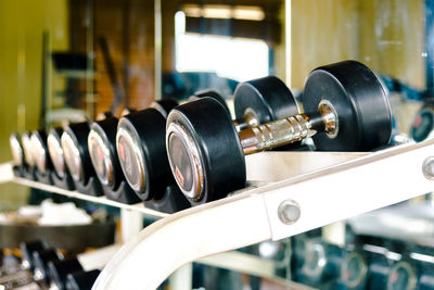 Close-up of dumbbells on rack