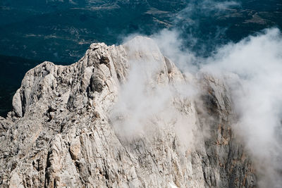 Scenic view of mountain against clouds and sky