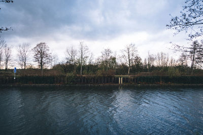 Scenic view of lake against sky at sunset