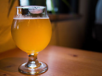 Close-up of beer in glass on table