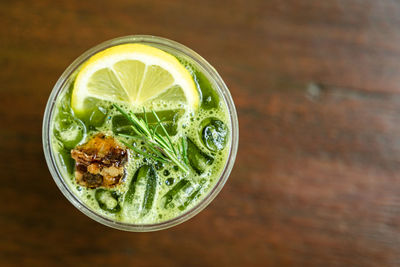 Close-up shot of delicious honey lemon green tea drink