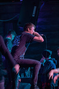 Man playing guitar at music concert