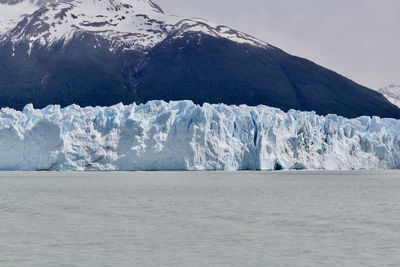 Scenic view of snowcapped mountains and glacier against sky