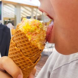 Close-up of child eating ice cream