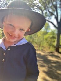 Portrait of young woman wearing hat