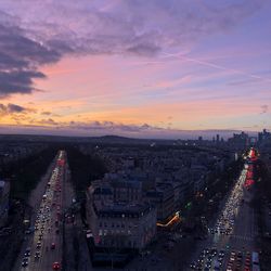 High angle view of traffic on city street during sunset