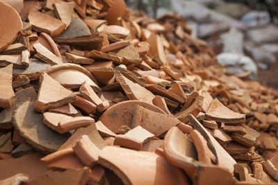 Close-up of pile of broken clay pottery