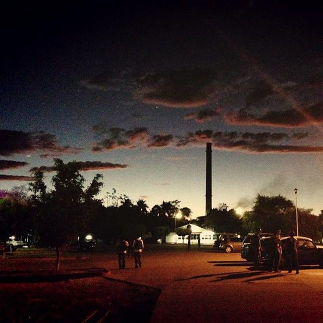 tree, sky, street light, road, sunset, street, the way forward, silhouette, cloud - sky, transportation, dusk, built structure, illuminated, lighting equipment, building exterior, architecture, outdoors, nature, incidental people, city