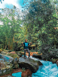 Portrait of man in outbound clothes on the river