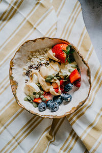 High angle view of strawberries in plate on table