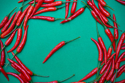 High angle view of red chili peppers on table