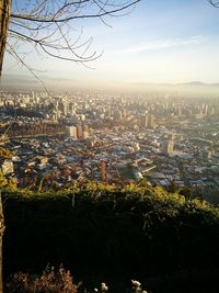 High angle view of city buildings against sky