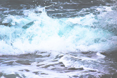 Waves splashing on rocks