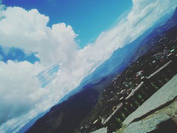 Aerial view of landscape against cloudy sky