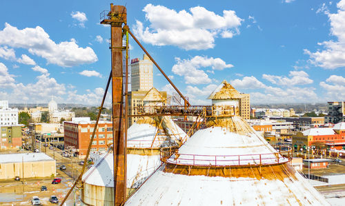 High angle view of buildings in city against sky