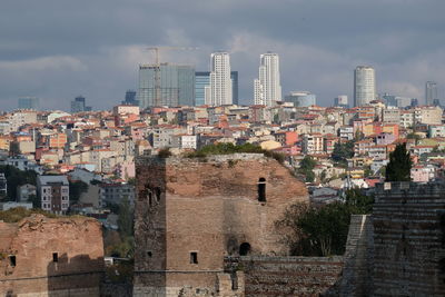 Buildings in city against sky