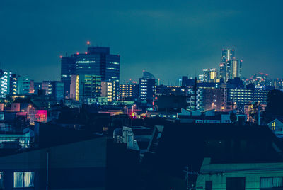 Illuminated buildings in city at night