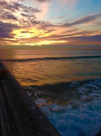 Scenic view of sea against sky at sunset