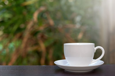 Close-up of coffee cup on table