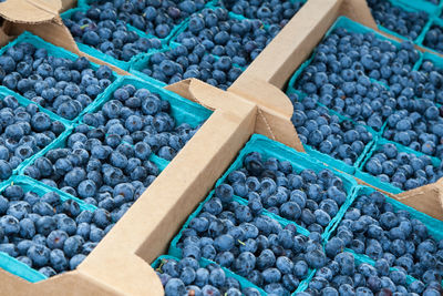 High angle view of blueberries for sale in market