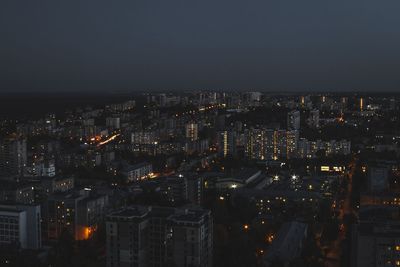 High angle view of illuminated buildings in city at night