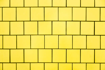 Full frame shot of yellow tiled wall