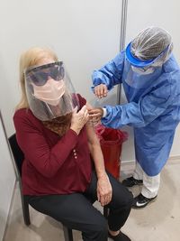 Midsection of woman holding umbrella