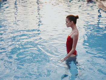 Full length of boy swimming in pool