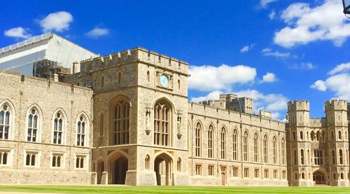 Low angle view of historical building against blue sky