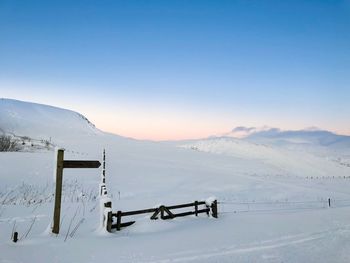 Scenic view of snow covered mountains against sky