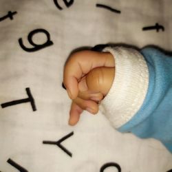 High angle view of baby hand