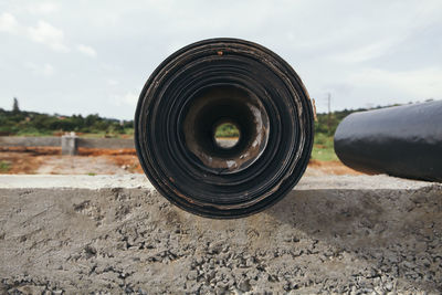 Rolled up tarpaulin on cement wall