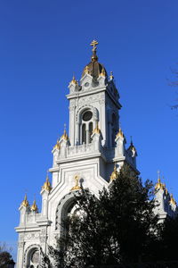 Low angle view of building against blue sky