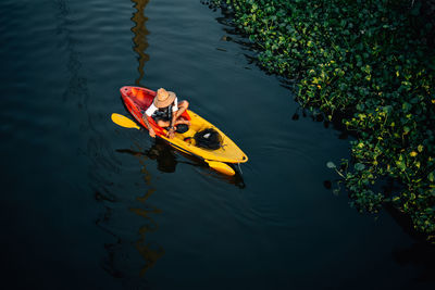 High angle view of toy boat in lake