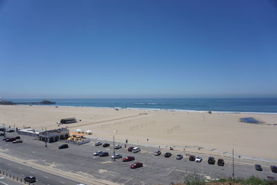 High angle view of cars on beach against clear sky