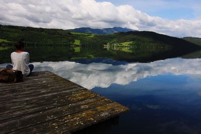 Scenic view of lake against cloudy sky