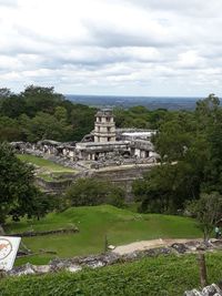 Ruins of temple against cloudy sky