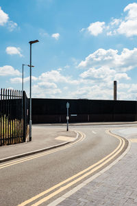 Empty road against sky