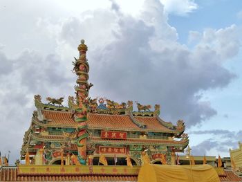 Low angle view of temple against building