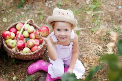 Portrait of smiling girl wearing basket