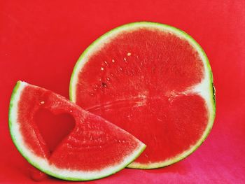 Close-up of strawberry against red background