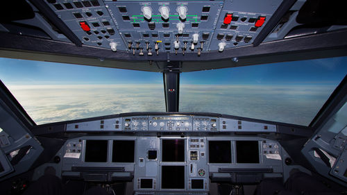 Cloudscape seen through airplane windshield