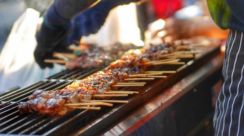 Low section of man preparing food