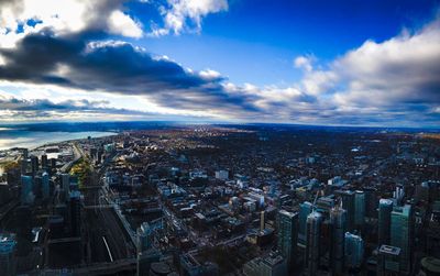 High angle view of city against cloudy sky