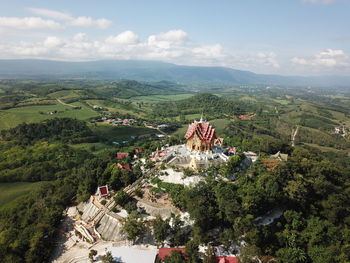 High angle view of trees and buildings in city