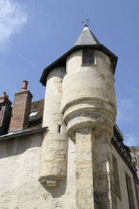 Low angle view of old building against sky