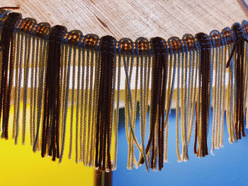 Close-up of clothes hanging on wood