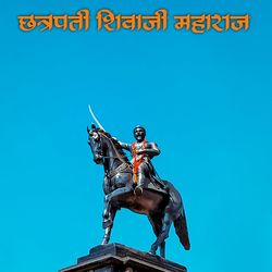 Low angle view of statue against blue sky